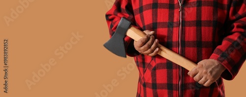 Lumberjack holding ax on be...