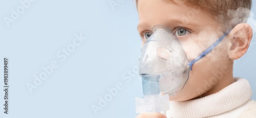 Little boy using nebulizer ...