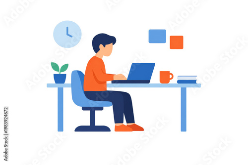 A young man sitting at a desk and working on his laptop in a home office environment.