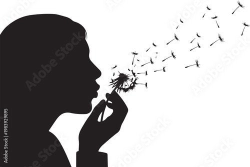 Silhouette of a child blowing dandelion seeds