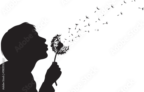 Silhouette of child blowing dandelion seeds