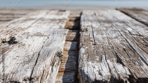 Close up perspective of weathered gray wooden boards on a sunny day with background, weathered