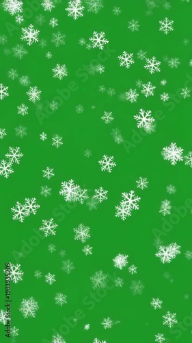 Snowflakes falling on green background