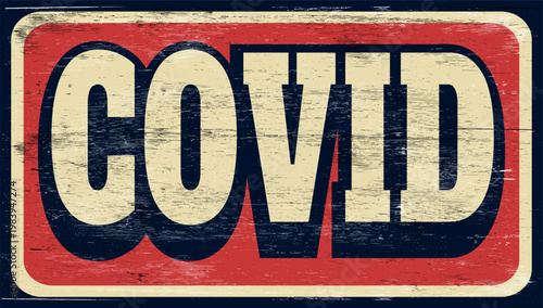 Aged and worn covid sign on wood