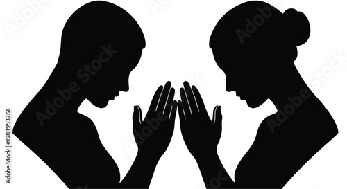 Two silhouetted people in profile touching hands in prayer or contemplation.