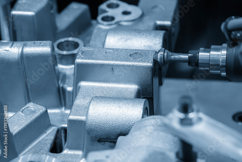 Fotografie Industrial robotic arm performing precision deburring and chamfering on aluminum casting parts