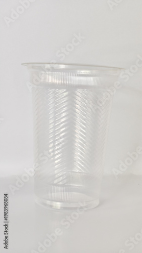 Empty transparent plastic cup for cold drinks, disposable water glass vector.
