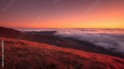 Sunset over misty valleys and rolling hills at twilight