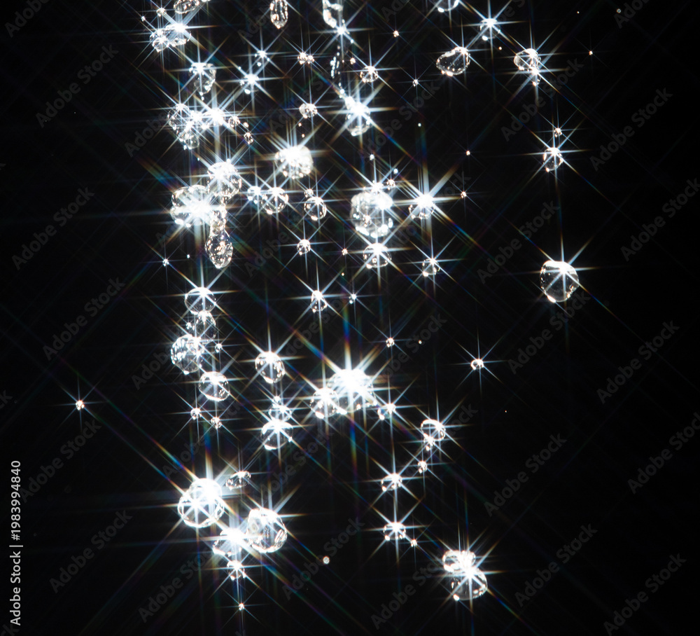 Obraz premium Shining water created sparkling splash with bright reflections and starburst flare, like star in light. Water Glitter from splash caught light, creating abstract sparkling scene with star flare