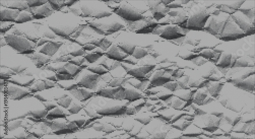 Crushed gray paper texture with deep shadows and sharp creases for backgrounds