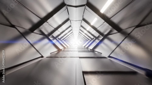Futuristic tunnel with metallic ceiling and bright light at end
