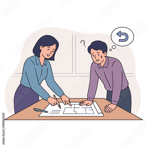 Two coworkers discussing and pointing at architectural plans on a table