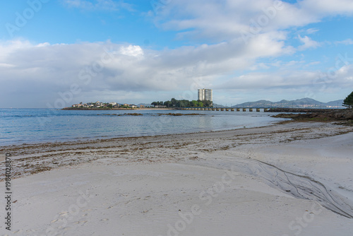 Toralla Island and its private bridge seen from the shore of Canido Beach in Vigo, Galicia