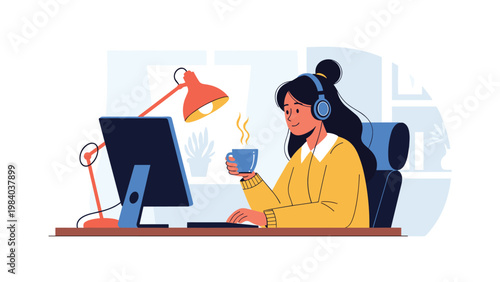 Young woman with headphones works at her desk with a laptop and a steaming cup of coffee in a comfortable indoor environment.