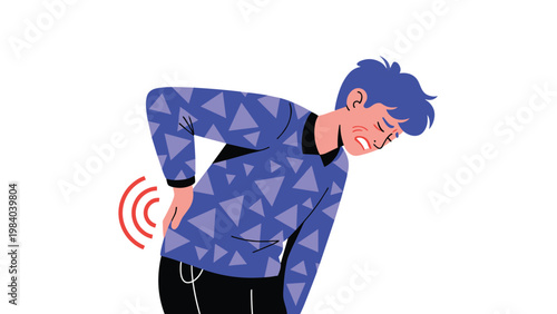 Young man in a blue patterned shirt expresses severe discomfort and pain while clutching his lower back against a white background.