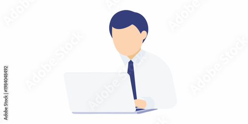 A faceless man in a suit working intently on a laptop computer