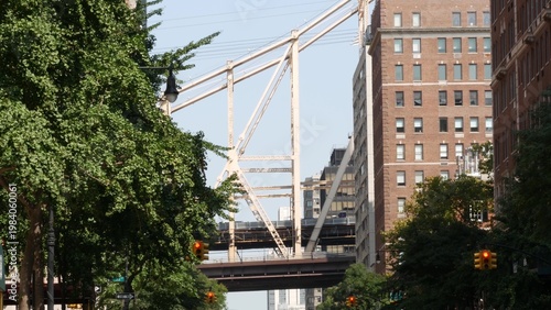 New York City Manhattan Midtown street, Queensboro bridge architecture, United States. Urban transport bridge and red brick residential buildings. Metallic bridge in East Side. Sutton Place traffic.