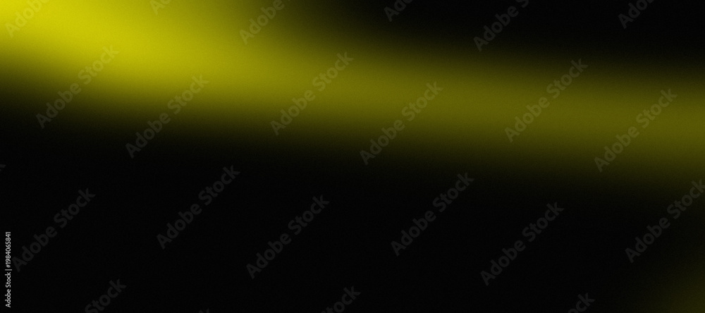 Obraz premium Vibrant yellow light streak on a dark background with glowing effect and shadow