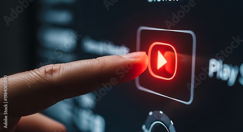 A finger pressing the play button on a YouTube video