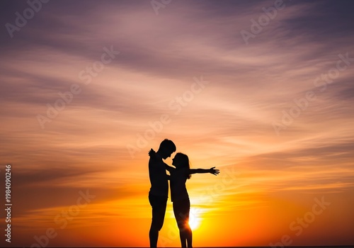 Couple embraces as they watch the sunset over a brick wall