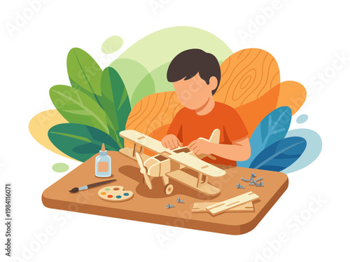 Boy assembling a wooden model airplane toy on a wooden table