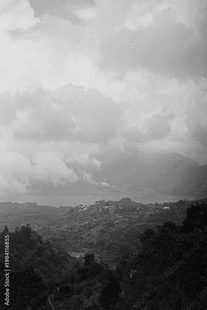 Fototapeta premium Black and white dramatic panorama of Lake Batur volcano and valley