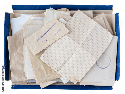 Old handwritten letters and blank lined paper in a blue cardboard box top view isolated on white, concept for archive memory and personal correspondence