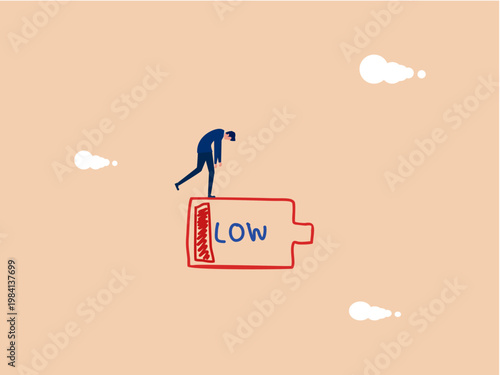 businessman is exhausted from working on a low battery.