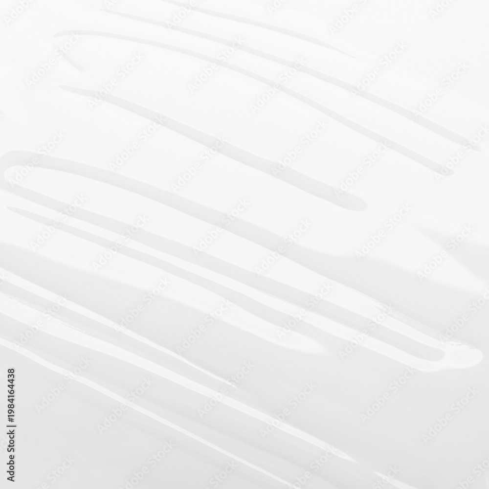 Obraz premium Abstract glossy texture of white liquid cosmetic serum or lotion seamless background with soft smooth waves