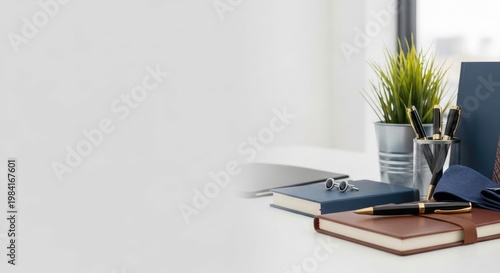 Minimalist workspace with books plants and stationery