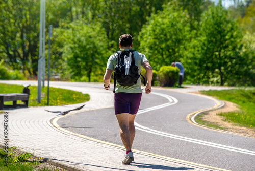 Wallpaper Mural A man Jogging in a summer Park
 Torontodigital.ca