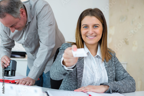 Fotografie a successful businesswoman exchanging businesscards