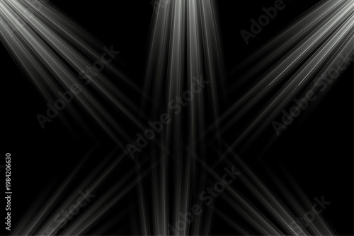 Dramatic light effect beams of light shining down on a black background