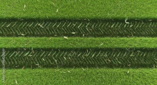 Aerial View of Freshly Mown Green Grass with Tractor Tire Tracks.