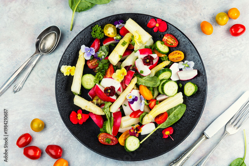 Fresh Spring Salad with White Asparagus, Radish, Cherry Tomatoes and Edible Flowers