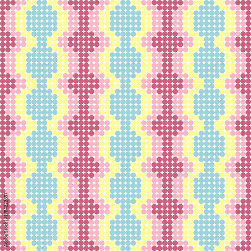 A playful and colorful dotted geometric pattern with light blue, yellow, and various shades of pink and red circles.