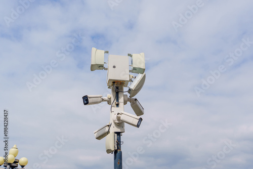 Security systems are installed on a tall pole for public safety