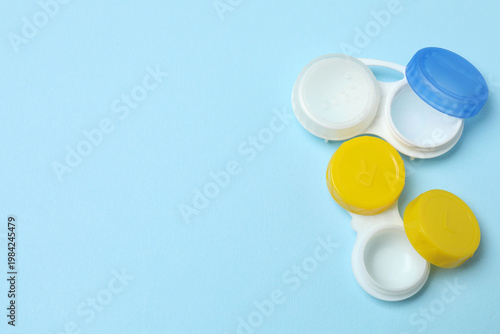 Case for contact lenses on blue background, top view