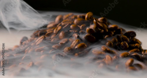 Extreme close-up of roasted coffee beans with visible steam rising, highlighting rich texture and warmth in soft, cinematic lighting. Shallow depth of field with smooth background blur
