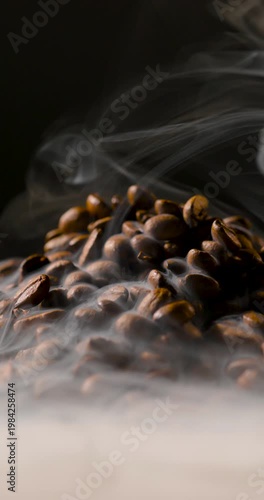 Extreme close-up of roasted coffee beans with visible steam rising, highlighting rich texture and warmth in soft, cinematic lighting. Shallow depth of field with smooth background blur