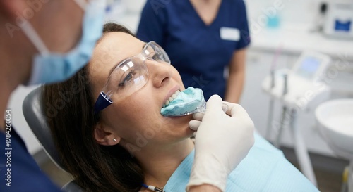Patient getting a dental impression at a modern clinic.