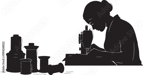 Woman sewing on a machine with thread spools, silhouette