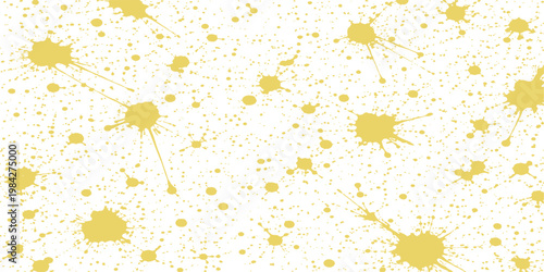 Abstract design of scattered splatters of yellow paint, creating a textured pattern. evoking creativity.