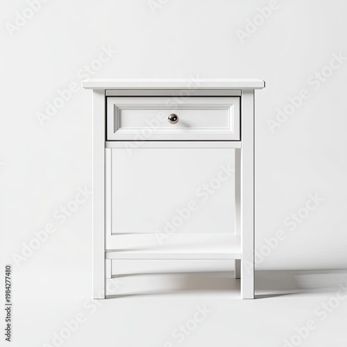 A minimalist white bedside table stands against a plain white background, showcasing clean lines and a simple design.