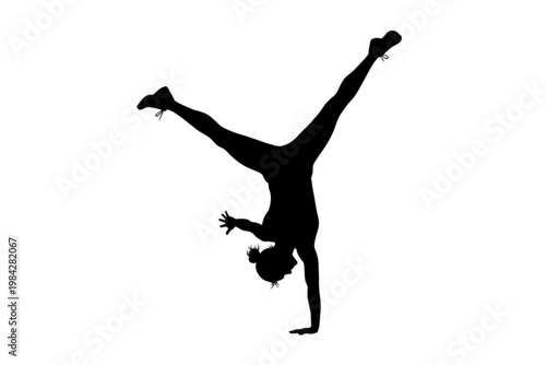 Silhouette of a Gymnast: A stunning silhouette captures a gymnast gracefully executing a flawless handstand, highlighting strength and balance against an open backdrop.
