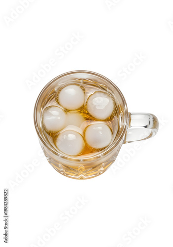 Whiskey with ice in crystal glass isolated on transparent background