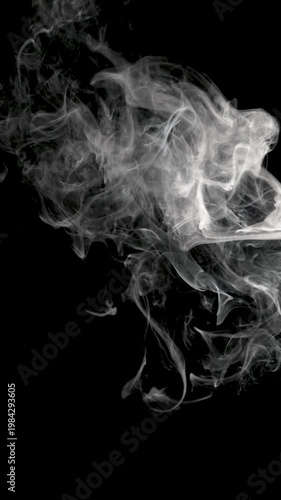 Wispy white smoke curls and twists in fluid, organic patterns against a deep black background, forming an abstract composition with ample copy space and high contrast
