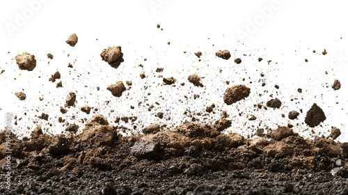 Earth and scattered rocks against black background. Close-up of soil disturbance