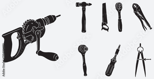 Collection of vintage and modern hand tools including a hand drill, hammer, saw, wrenches, pliers, screwdriver, and compass.