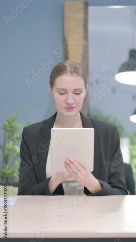 Wallpaper Mural Businesswoman using Digital Tablet, Browsing Internet, Vertical Video Torontodigital.ca